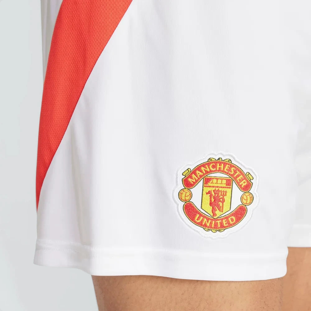 A close-up of the intricate embroidery of the Manchester United shield.
