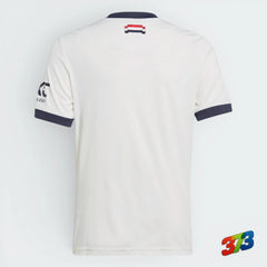 Details the high-definition embroidery and the precision of the tricolour bar.