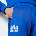 Highlighting the intricate detail of the vintage Manchester coat of arms.