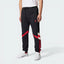 The Black track pants, highlighting the bold, oversized red 3-Stripes and the tapered leg.