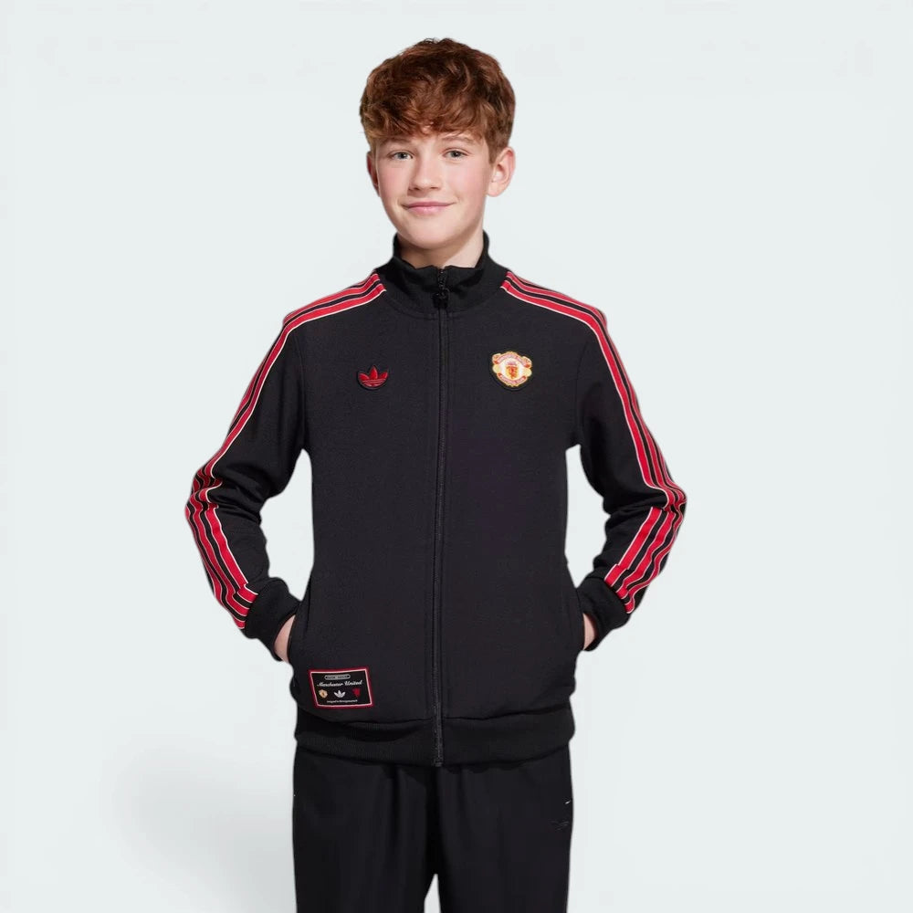 Child wearing a black tracksuit with red stripes on a white background