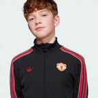 Close-up of the Manchester United vintage crest, highlighting the intricate embroidery and heritage details.