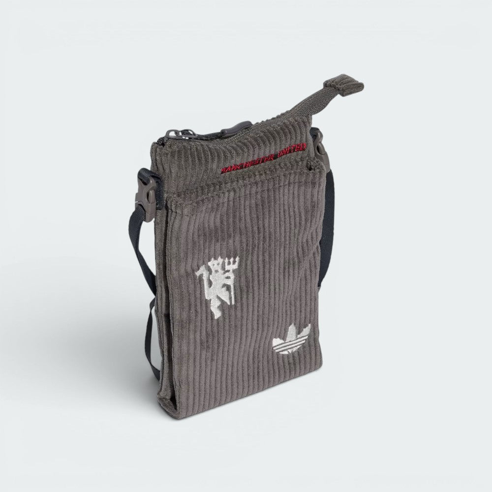 Focuses on the locked-in attachment clips and the professional adidas branding.