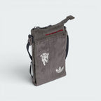Focuses on the locked-in attachment clips and the professional adidas branding.
