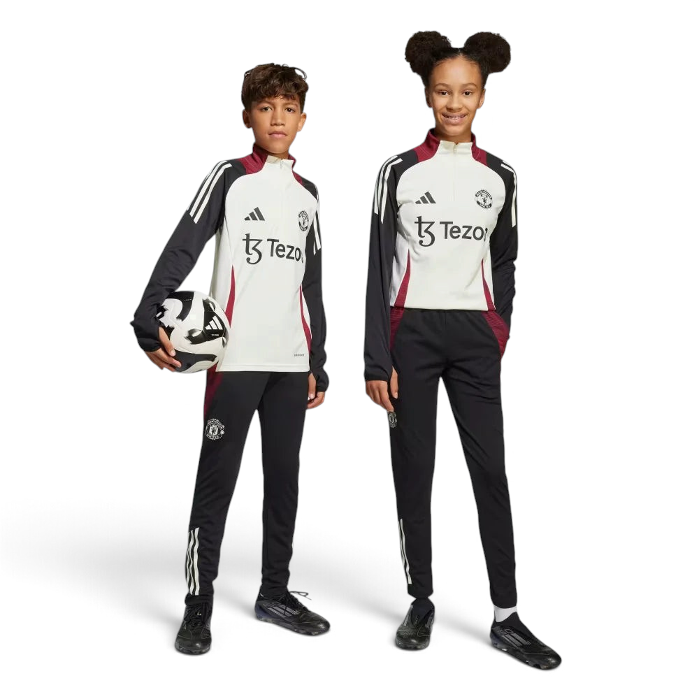 Side profile of the Kids' Man Utd Tiro 24 pants, highlighting the slim, tapered leg and the classic white 3-Stripes branding. Main image
