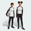Side profile of the Kids' Man Utd Tiro 24 pants, highlighting the slim, tapered leg and the classic white 3-Stripes branding.