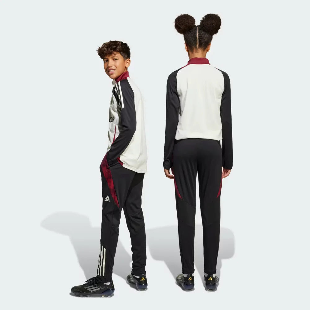 View from behind looking at the seat, showcasing the athletic cut and the structured drape of the training gear.