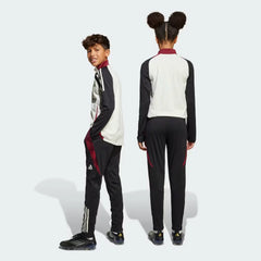 View from behind looking at the seat, showcasing the athletic cut and the structured drape of the training gear.
