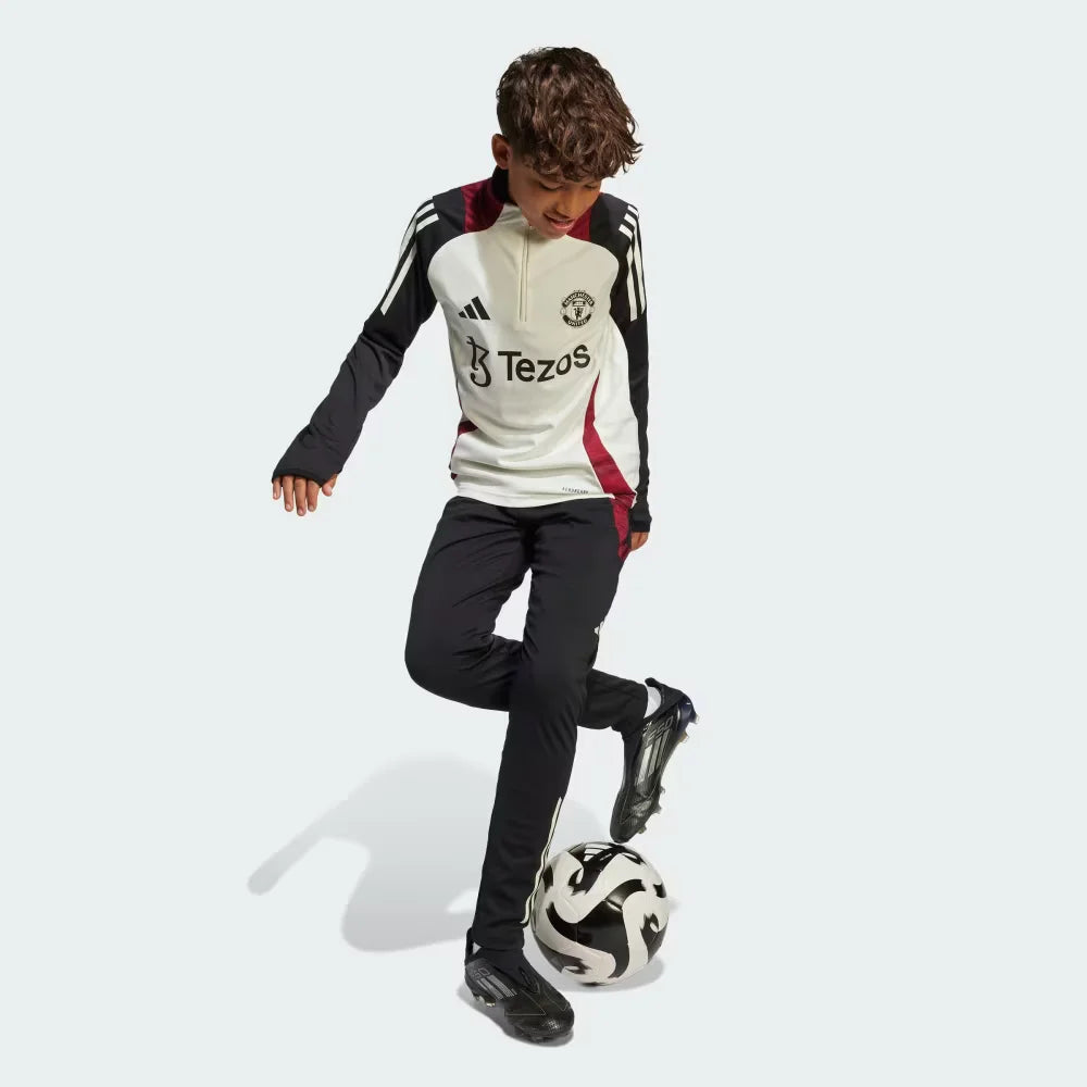 Angle view showing the lower leg, emphasizing the functional ankle zips and the sleek cuff finish.
