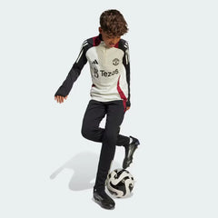 Angle view showing the lower leg, emphasizing the functional ankle zips and the sleek cuff finish.