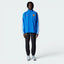 Highlights the high-velocity sweep of the bold piping details stretching along the shoulder and sleeve panels.