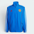 Details the high-definition embroidery of the legendary Manchester United crest and the crisp execution of the piping borders.