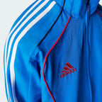 Details the high-definition embroidery of the legendary adidas logo and the crisp execution of the piping borders.