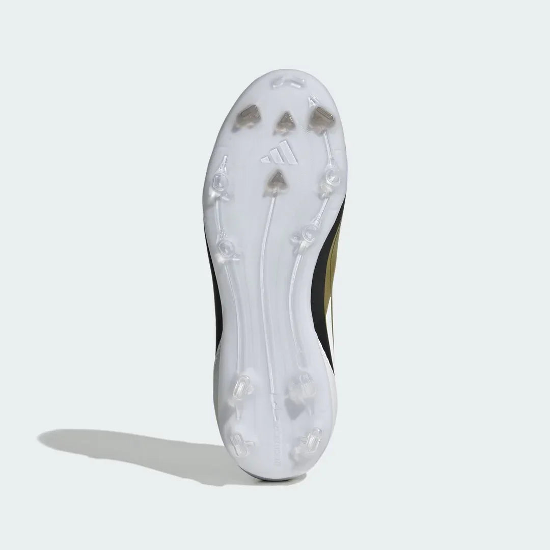 View of the outsole of the Adidas Messi F50 League FG/MG Juniors' boots, showing the versatile stud configuration for natural and artificial grass.
