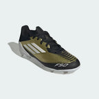 Angled view of Adidas Messi F50 League FG/MG Juniors' football boots in gold, showcasing their lightweight design and iconic Messi logo.