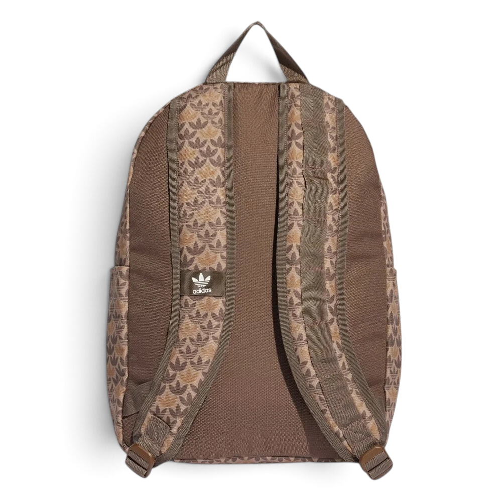 Focuses on the contoured shape of the solid brown back panel, highlighting the repeating monogram patterning lining the upper face of the adjustable shoulder straps.