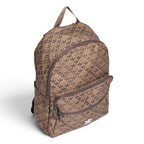 Highlights the backpack sitting at a three-quarter angle, showing the depth of the front zip pocket compartment and the streamlined slip-in pocket on the flank.