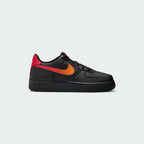 Highlights the high-velocity Fire Red Nike Swoosh slashing across the professional depth of the black synthetic leather upper and the classic thick midsole wall.