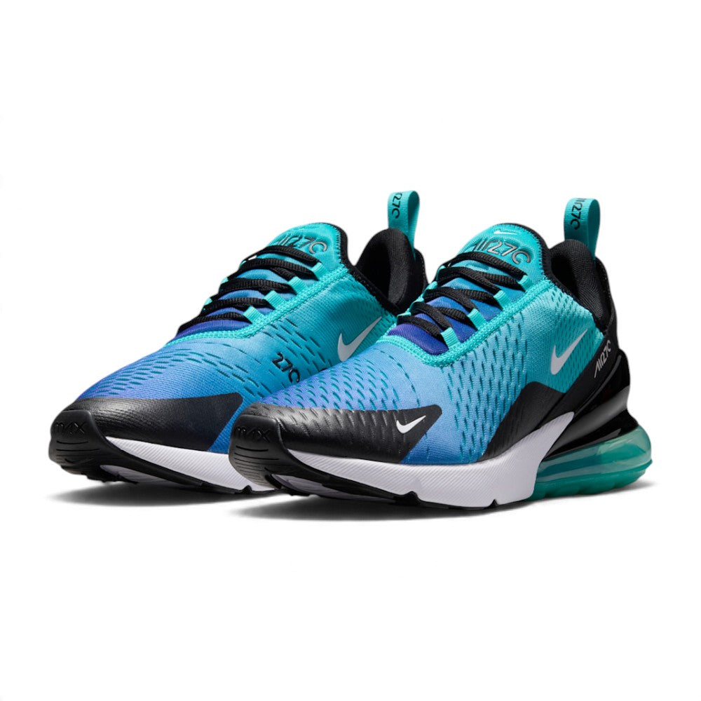 Three-quarter forward angle showcasing both sneakers side by side, highlighting their dynamic blue gradient silhouette and large volume Air units.