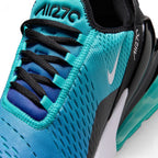 Macro focus on the forefoot and eyestay, detailing the engineered mesh ventilation holes, black laces, and toe cap branding.