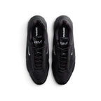 Focuses on the locked-in central lacing layout, displaying black laces, tonal eyestay cages, dark mesh toe boxes, and black tongue badges printed with the metallic silver "aM" Air Max logo.