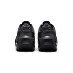 Focuses on the rear profile, highlighting the raised black heel counters stamped with debossed "aM" Air Max logos, and the wide flared footprint of the sculpted black foam heel base.