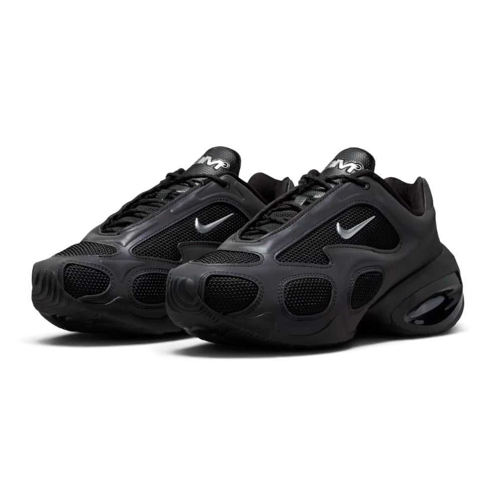 Emphasising the sculpted three-quarter stance of the shoes and the sleek contrast between the smooth black overlays, breathable mesh underlays, and metallic silver Swooshes.