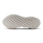 Displays the full-length ultralight outsole, showcasing the thin strategic rubber tread pods designed for targeted grip and maximum flexibility.