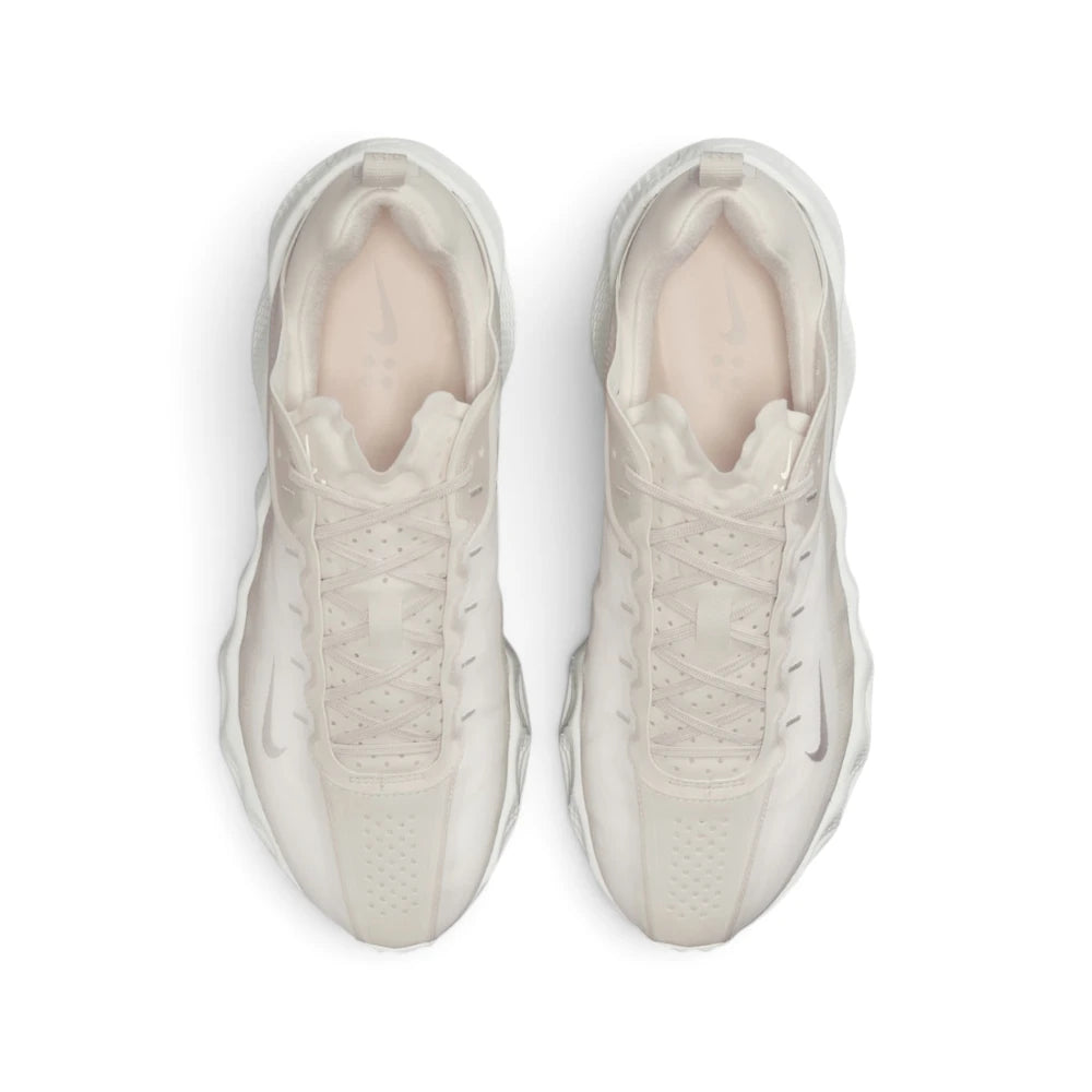 Focuses on the locked-in central lacing layout, displaying the perforated forefoot toe box, Phantom laces, padded ankle collar, and tonal insoles printed with Nike branding.