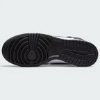 Displays the full-length solid black rubber sole, showcasing the classic basketball pivot-circle traction grid engineered for unreal multi-surface street grip.