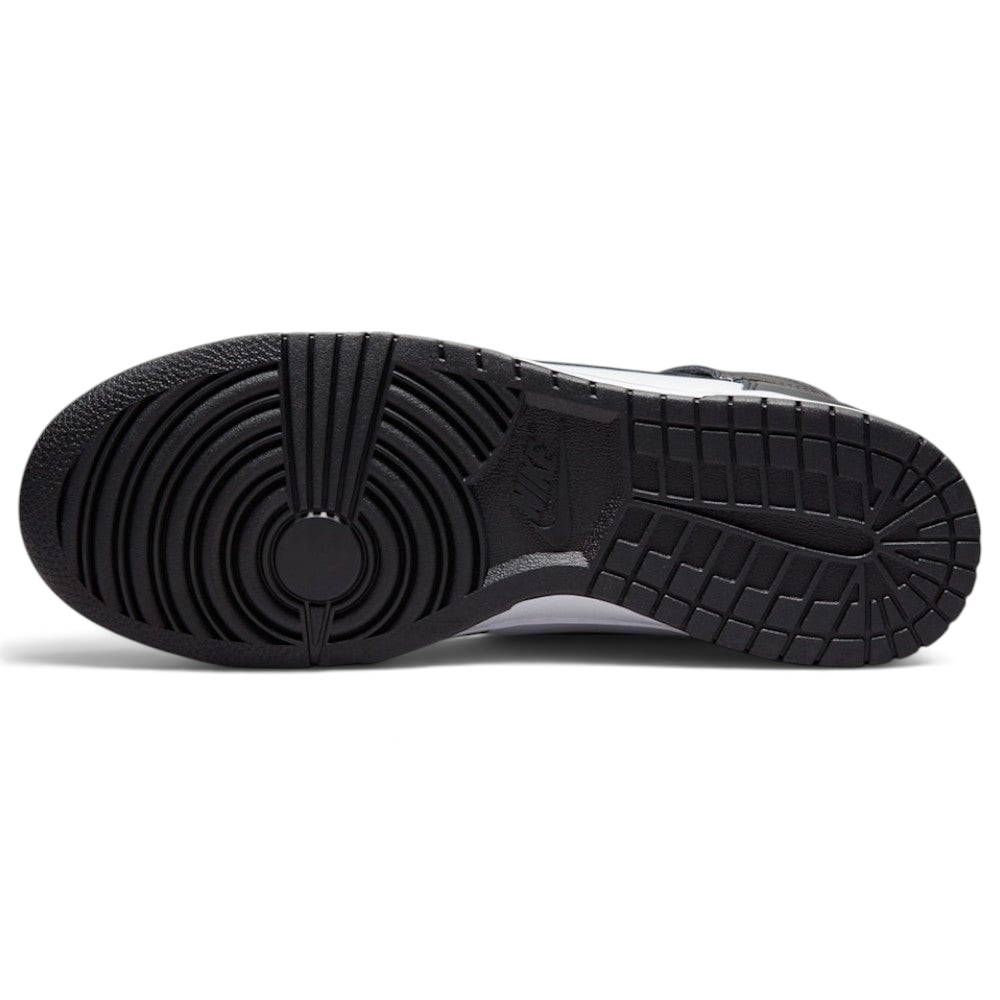 Displays the full-length solid black rubber sole, showcasing the classic basketball pivot-circle traction grid engineered for unreal multi-surface street grip.
