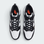 Focuses on the locked-in central lacing layout, displaying the symmetry of the white nylon tongue, black laces, black "NIKE" tongue patch, perforated toe box, and Total Orange "NIKE" branding printed on the black insoles.