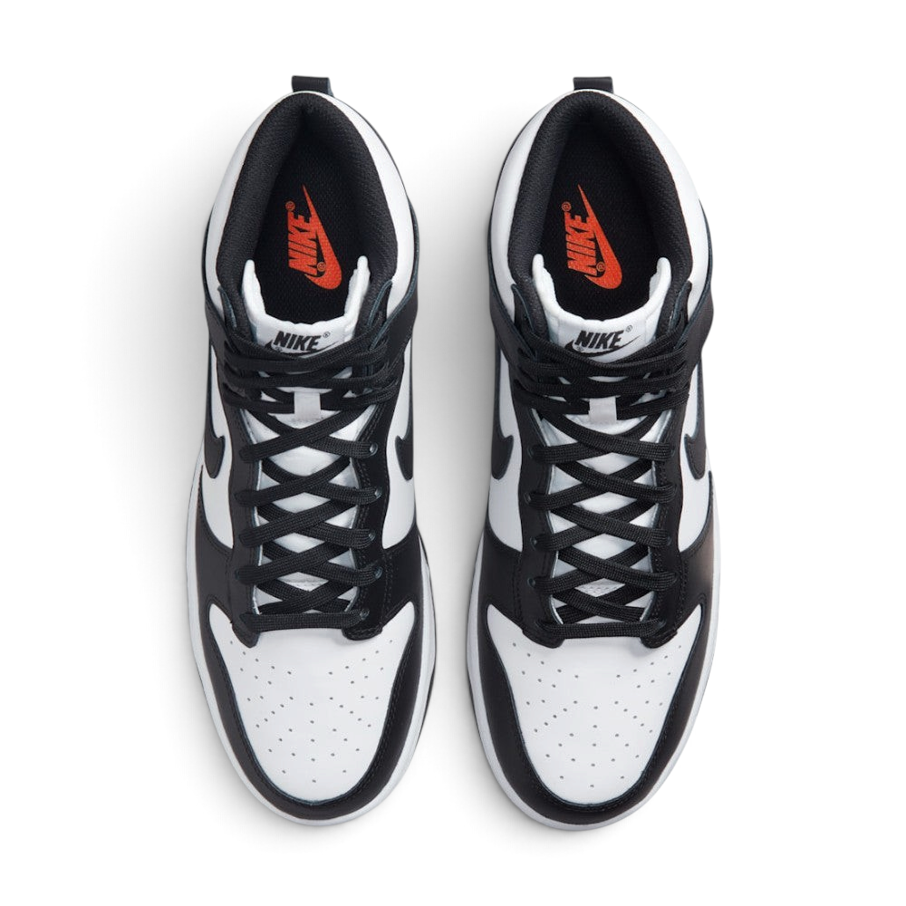 Focuses on the locked-in central lacing layout, displaying the symmetry of the white nylon tongue, black laces, black "NIKE" tongue patch, perforated toe box, and Total Orange "NIKE" branding printed on the black insoles.