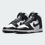 Emphasising the aggressive, forward-leaning basketball stance of the high-tops and the striking monochrome contrast between the white bases and black overlays.