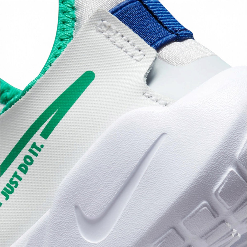 Detailed close-up angle capturing the green Swoosh logo accompanied by the signature "JUST DO IT." text printed along the side panel.