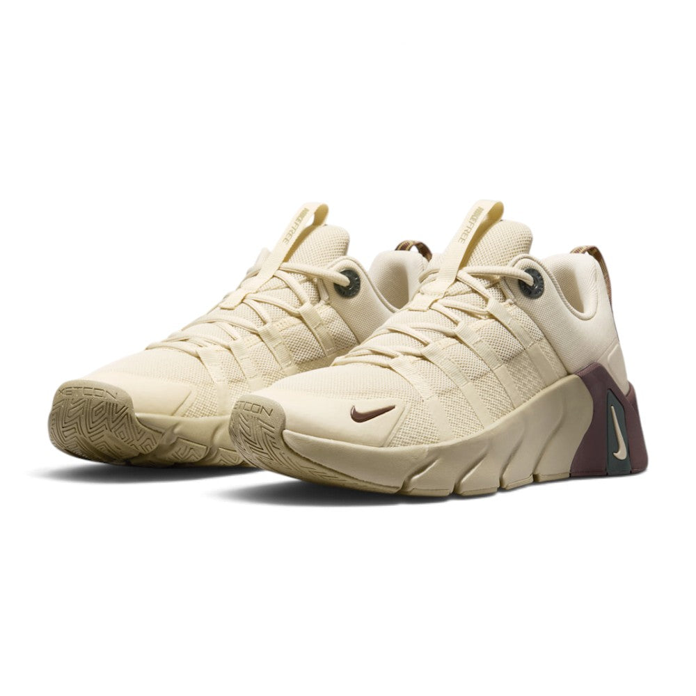 Forward three-quarter angle showcasing both shoes side by side, highlighting the rugged toe durability overlays, the clean earth-tone colour blocking, and the athletic training stance.