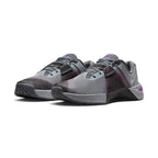 Emphasising the wide, grounded stance of the cross-training shoes and the dark-to-light gradient contrast across the engineered mesh toe box and lateral rubber stability wraps.