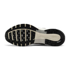 Focusing on the durable full-length black rubber outsole featuring waffle-inspired lug segments, forefoot flex grooves, and Pegasus-inspired traction pods, showcasing the grip matrix engineered for a successful tackle of city pavements, tarmac, and indoor flooring.