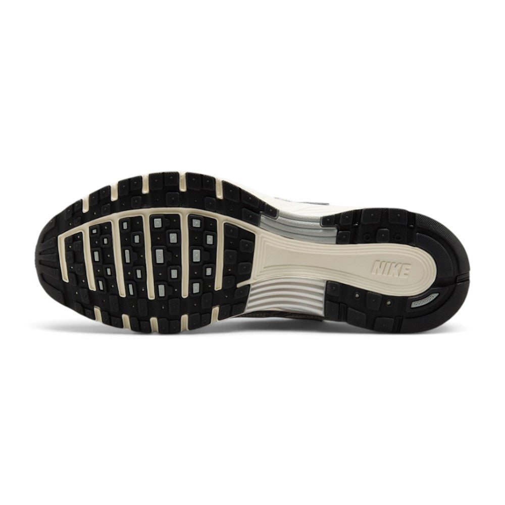 Focusing on the durable full-length black rubber outsole featuring waffle-inspired lug segments, forefoot flex grooves, and Pegasus-inspired traction pods, showcasing the grip matrix engineered for a successful tackle of city pavements, tarmac, and indoor flooring.