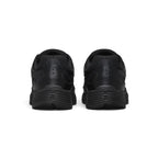 Focuses on the rear profile, displaying the structured black synthetic heel counter, micro-Swooshes, ventilation perforations, and the wide base of the ribbed black foam midsole.