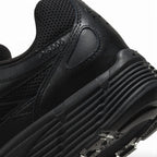 Highlights the "unreal" clean finish of the rear lateral quarter, displaying the debossed "P-6000" collar lettering, ribbed black foam midsole, and lugged rubber outsole tread.