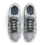 Focuses on the locked-in central lacing layout, displaying the flat dark grey laces, vertical tongue webbing stamped with "Bowerman Series" text, grey mesh tongues with Nike branding tabs, and cushioned grey insoles printed with black Swooshes.