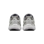 Focuses on the rear profile, displaying the structured Vast Grey synthetic heel counters, micro-Swooshes, ventilation perforations, and the wide base of the ribbed foam midsole.