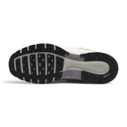 Displays the full-length rubber outsole, showcasing the multi-pod waffle traction pattern, grooved forefoot flex channels, debossed Nike branding, and high-abrasion rubber pods.