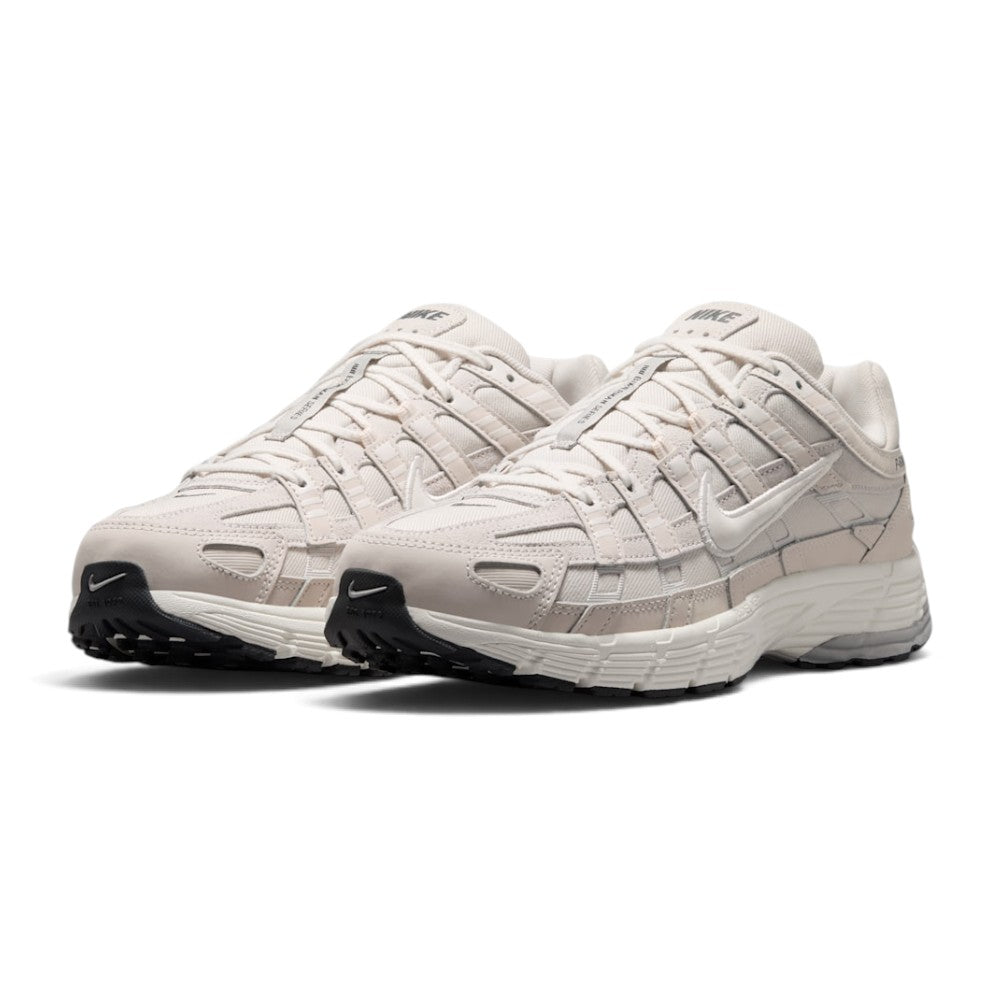 Emphasising the low-slung, technical stance of the trainers and the harmonious contrast between the light Phantom mesh base and layered Light Bone leather panels.