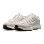 Emphasising the low-slung, technical stance of the trainers and the harmonious contrast between the light Phantom mesh base and layered Light Bone leather panels.