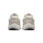 Focuses on the rear profile, displaying the structured synthetic heel counters, micro-Swooshes, ventilation perforations, and the wide base of the ribbed Sail foam midsole.