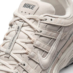 Details the micro-precision of the forefoot area, showing the textured Phantom mesh toe box, protective leather toe cap, flat laces, and central tongue webbing strip.