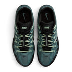 Focuses on the locked-in central lacing layout, displaying the flat Steam pale green laces, vertical tongue webbing stamped with "Bowerman Series" text, black mesh tongues with Nike branding tabs, and cushioned insoles printed with Mineral Slate Swooshes.