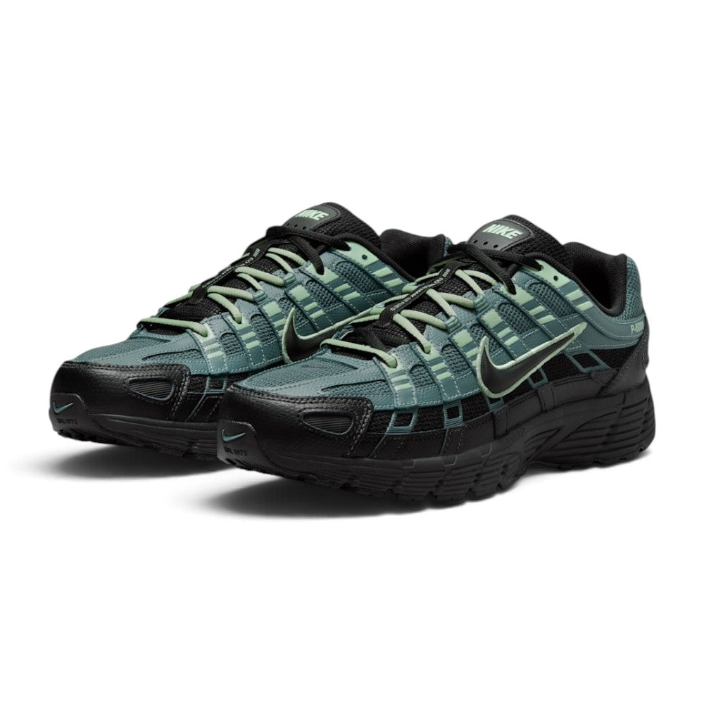 Emphasising the low-slung, technical stance of the trainers and the high-contrast harmony between the deep Mineral Slate mesh, textured black overlays, and bright Steam green lace details.